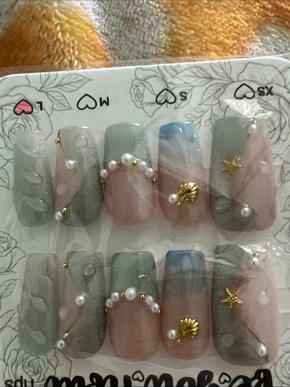 Gorgeous detail Pearl & Shell Press-On Nails in Sage Green and Blush Pink. New